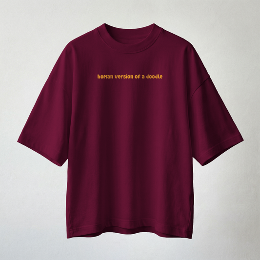 Burgundy oversized t-shirt with “human version of a doodle” text minimal aesthetic