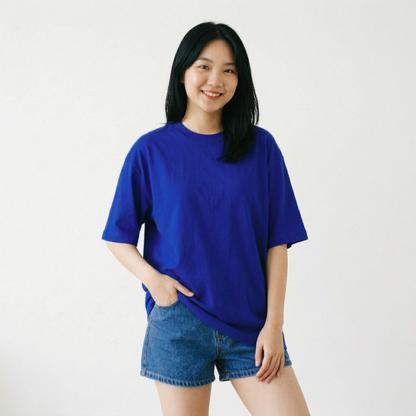 Woman wearing blue oversized t-shirt minimal front clean premium look