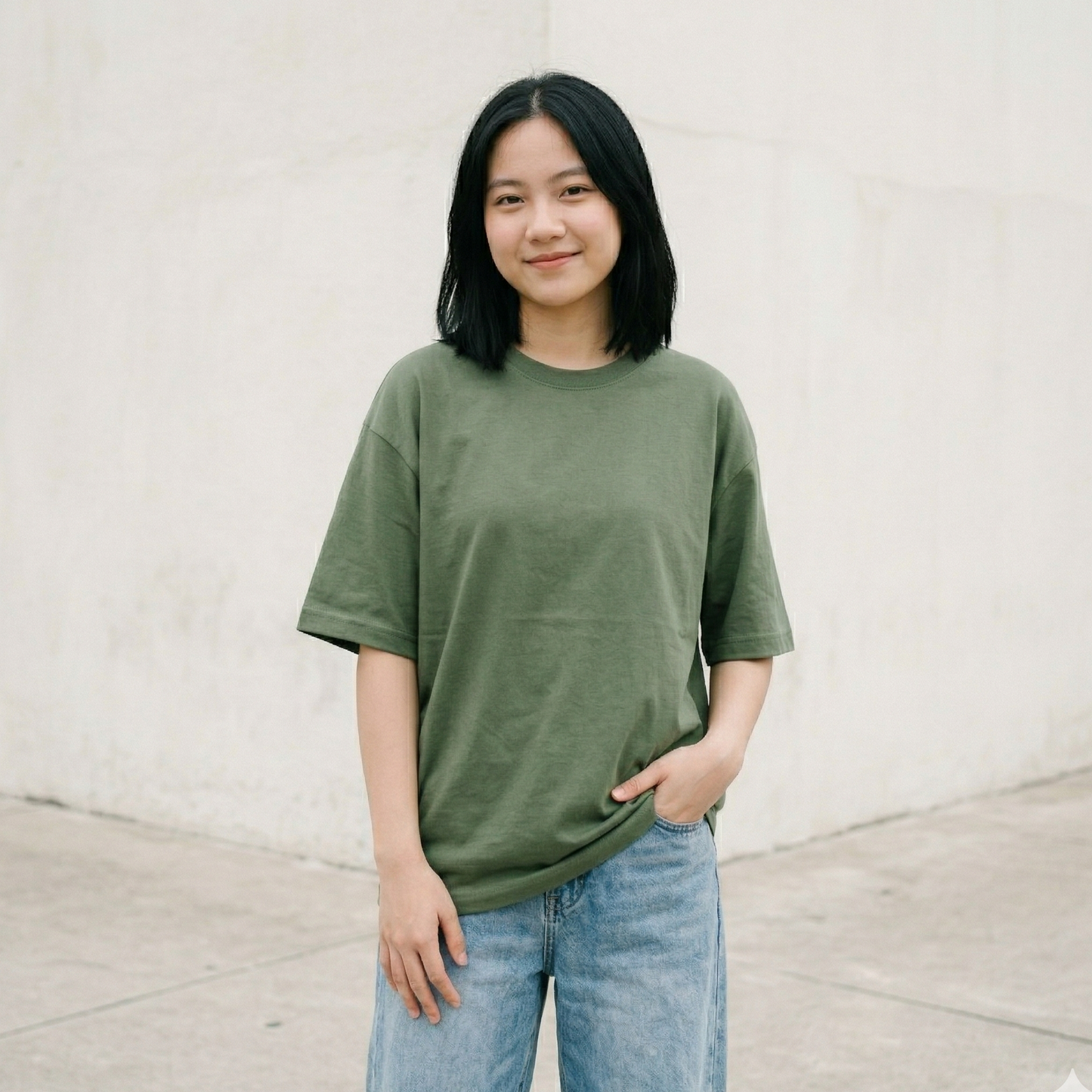 Woman wearing green oversized t-shirt outdoors