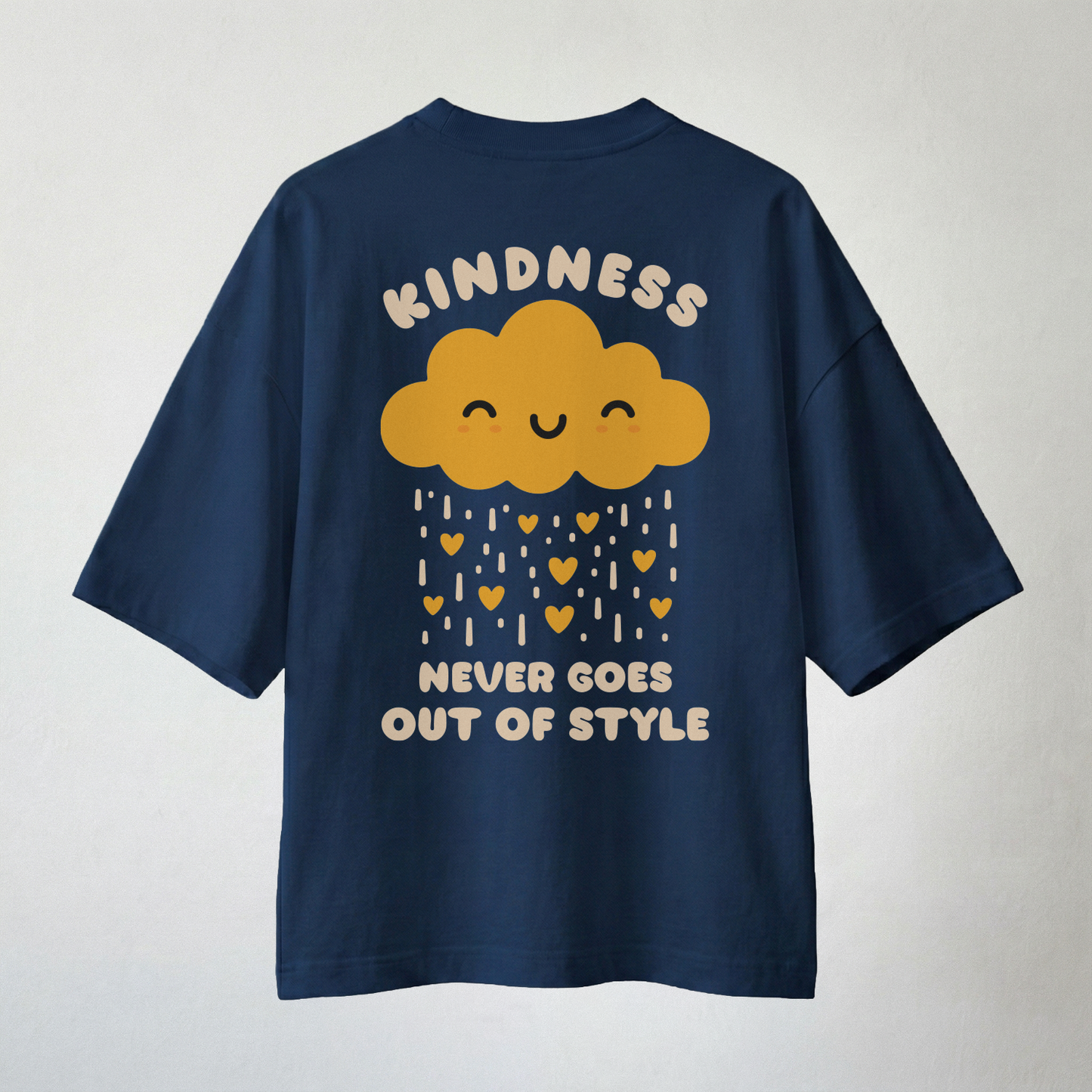 Navy oversized t-shirt with “Kindness Never Goes Out of Style” cloud and heart rain graphic on back