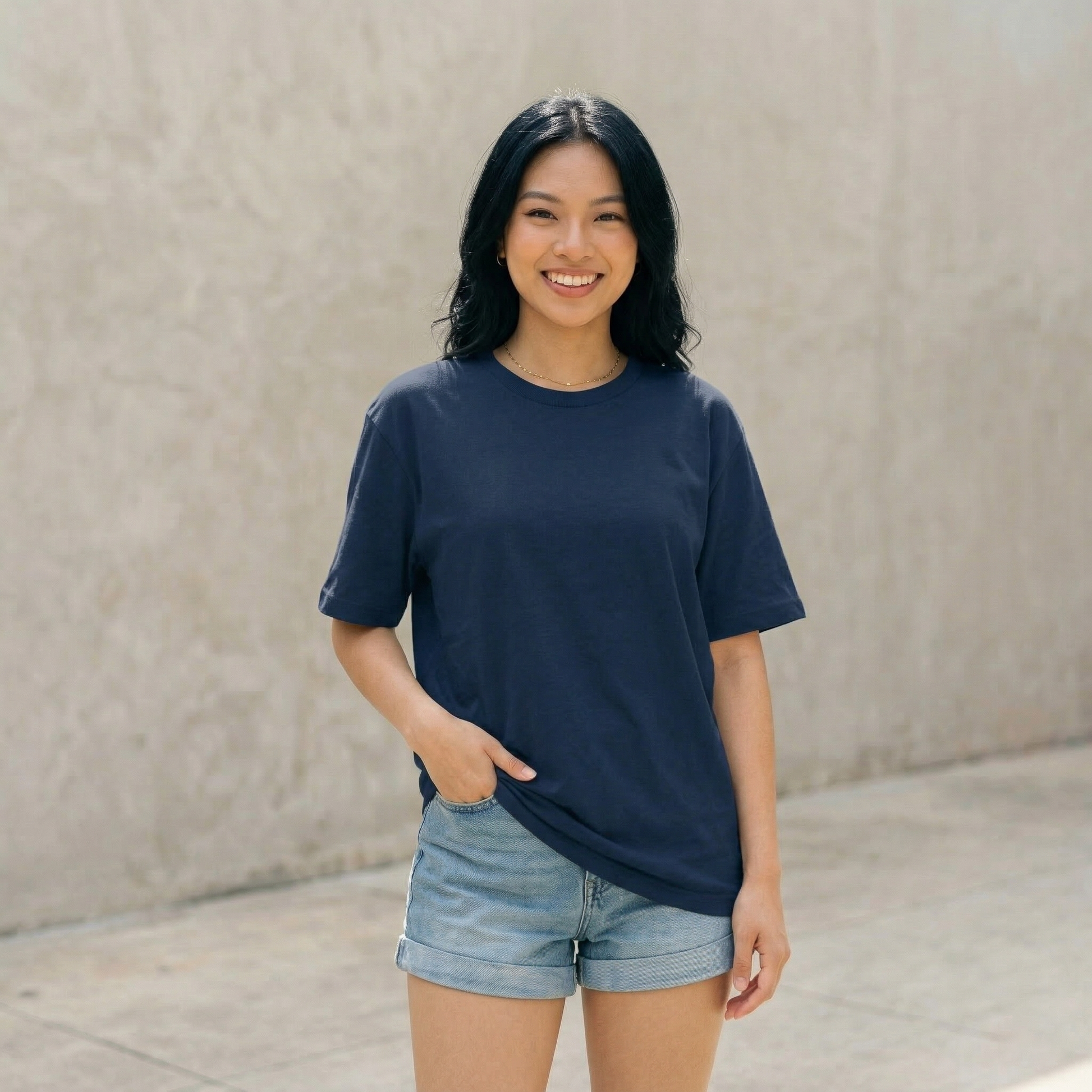 Woman wearing navy blue oversized t-shirt front view relaxed fit casual minimal style