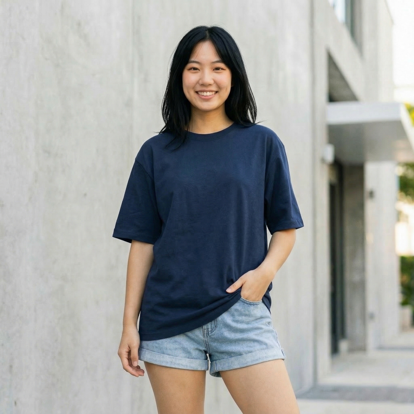Woman wearing navy oversized t-shirt front view relaxed fit casual minimal style