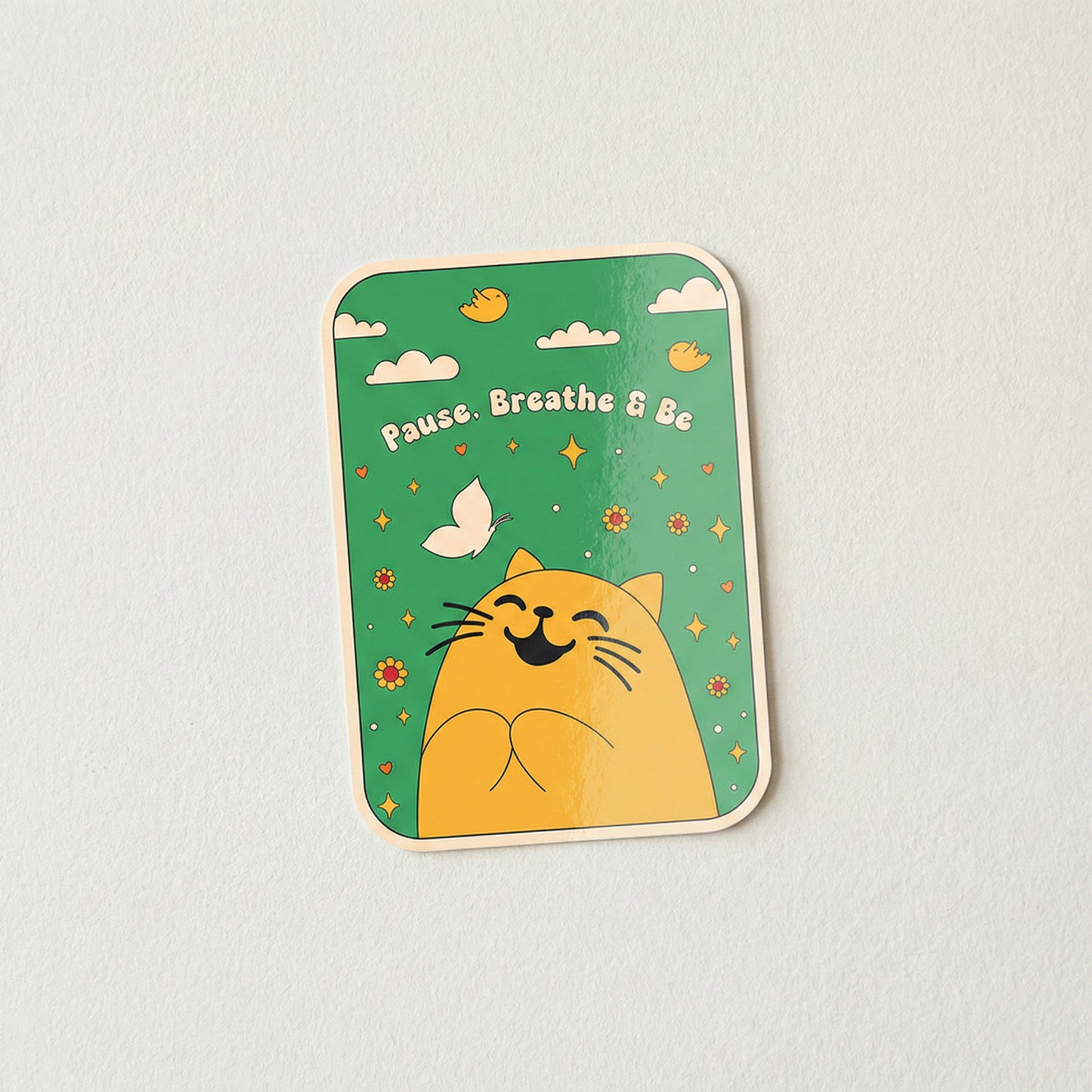 Pause Breathe and Be mindfulness sticker featuring happy yellow cat with flowers and butterflies