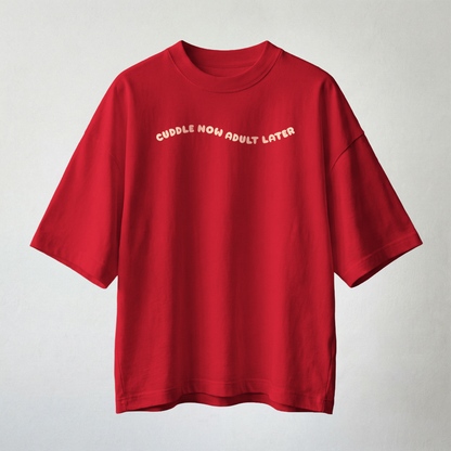 Red oversized t-shirt with “cuddle now adult later” text minimal aesthetic
