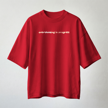 Red oversized t-shirt with “overthinking in progress” text minimal aesthetic