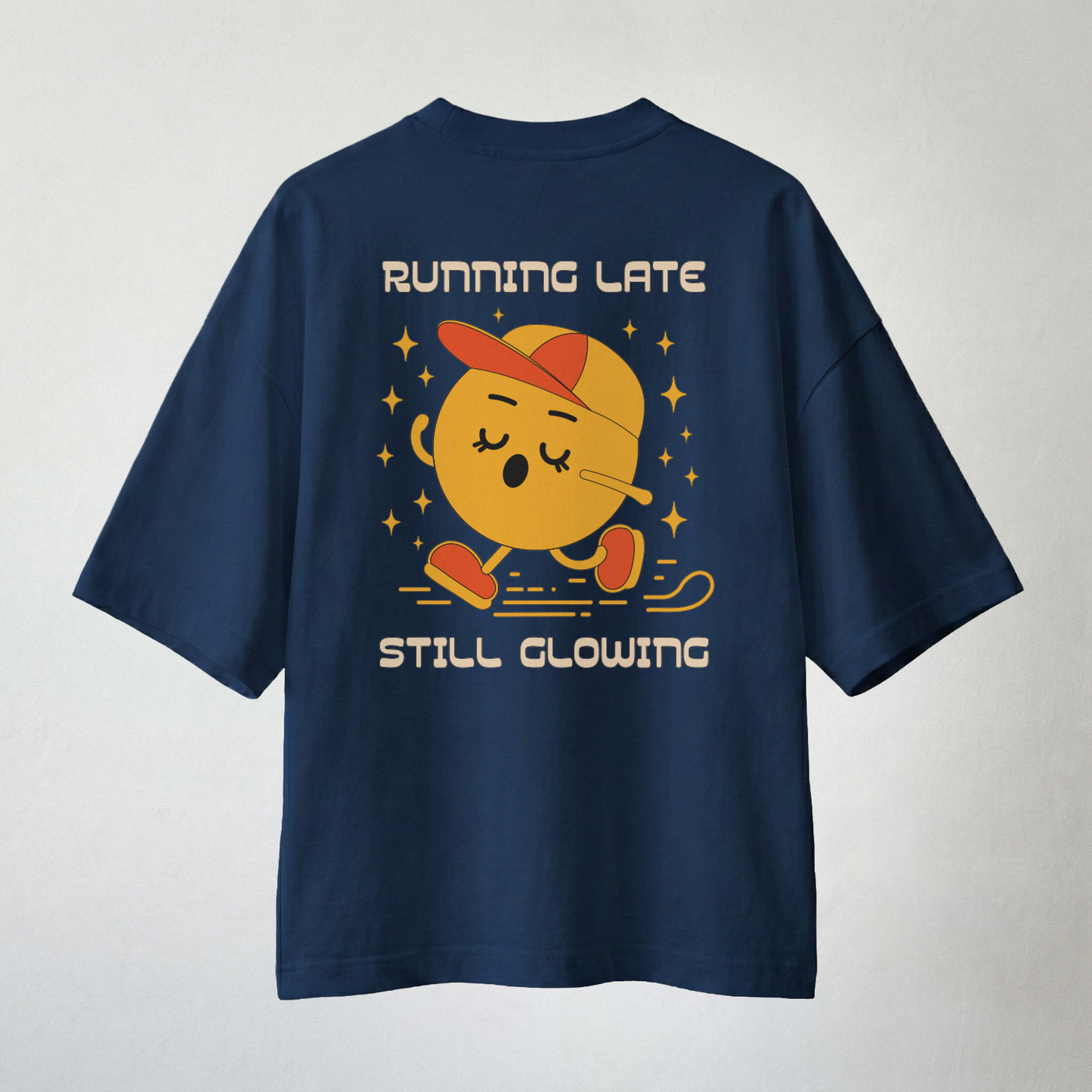 Navy blue oversized t-shirt with “Running Late Still Glowing” cartoon back print
