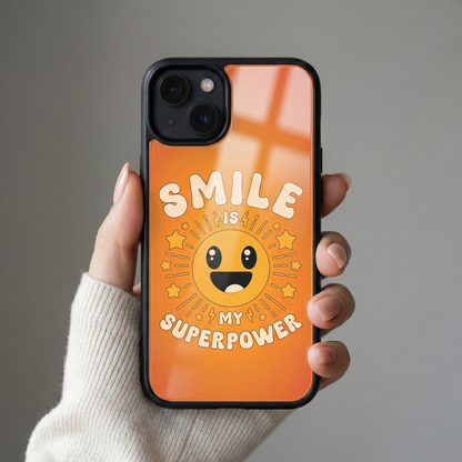 Hand holding Smile Is My Superpower glass iPhone case in natural light